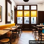Home 21 이색카페 프랜차이즈 추천 - A cozy, art-themed café interior in Madrid featuring vintage wooden tables, walls adorned with large...